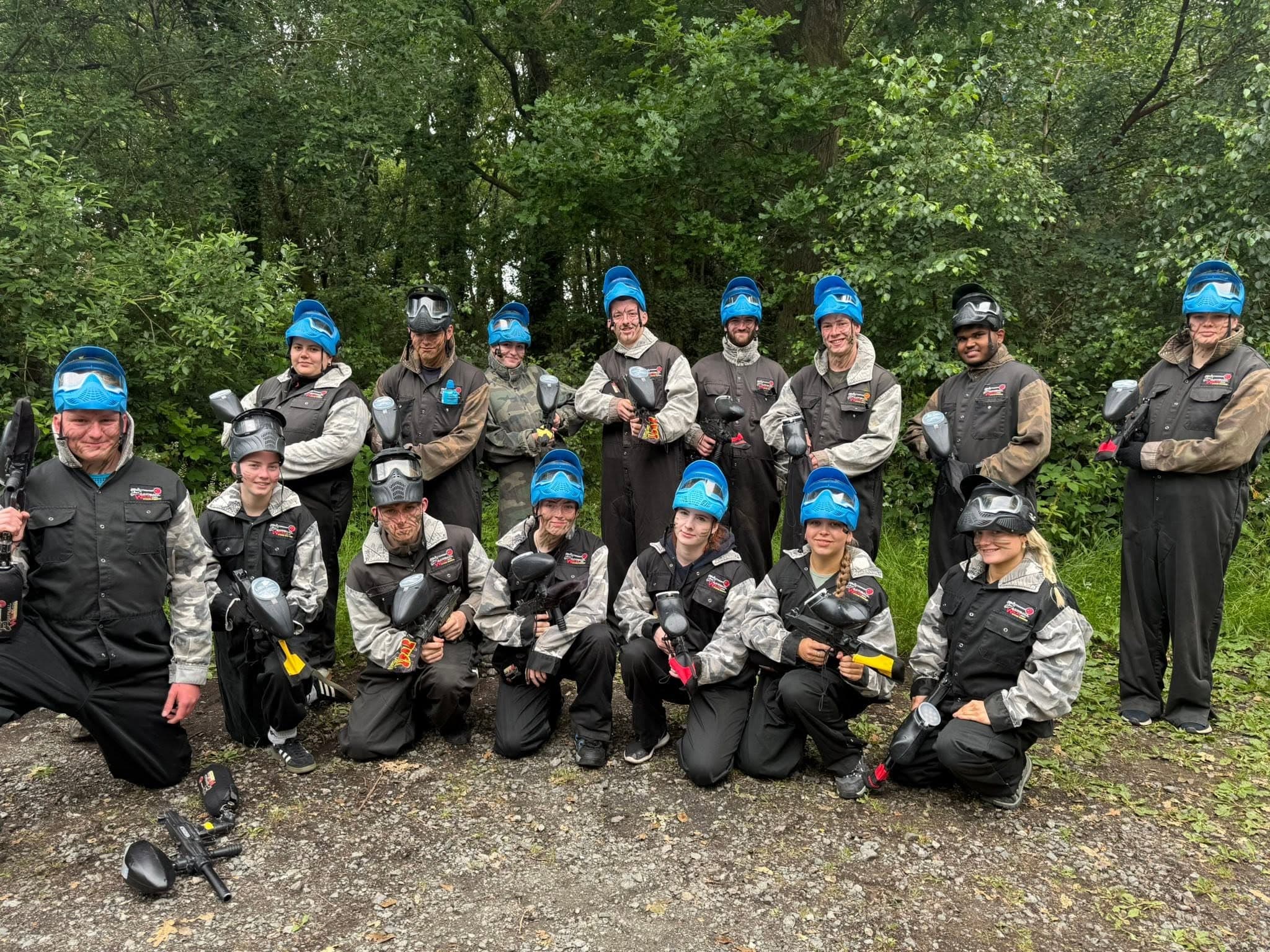 College group on a team building paintball day
