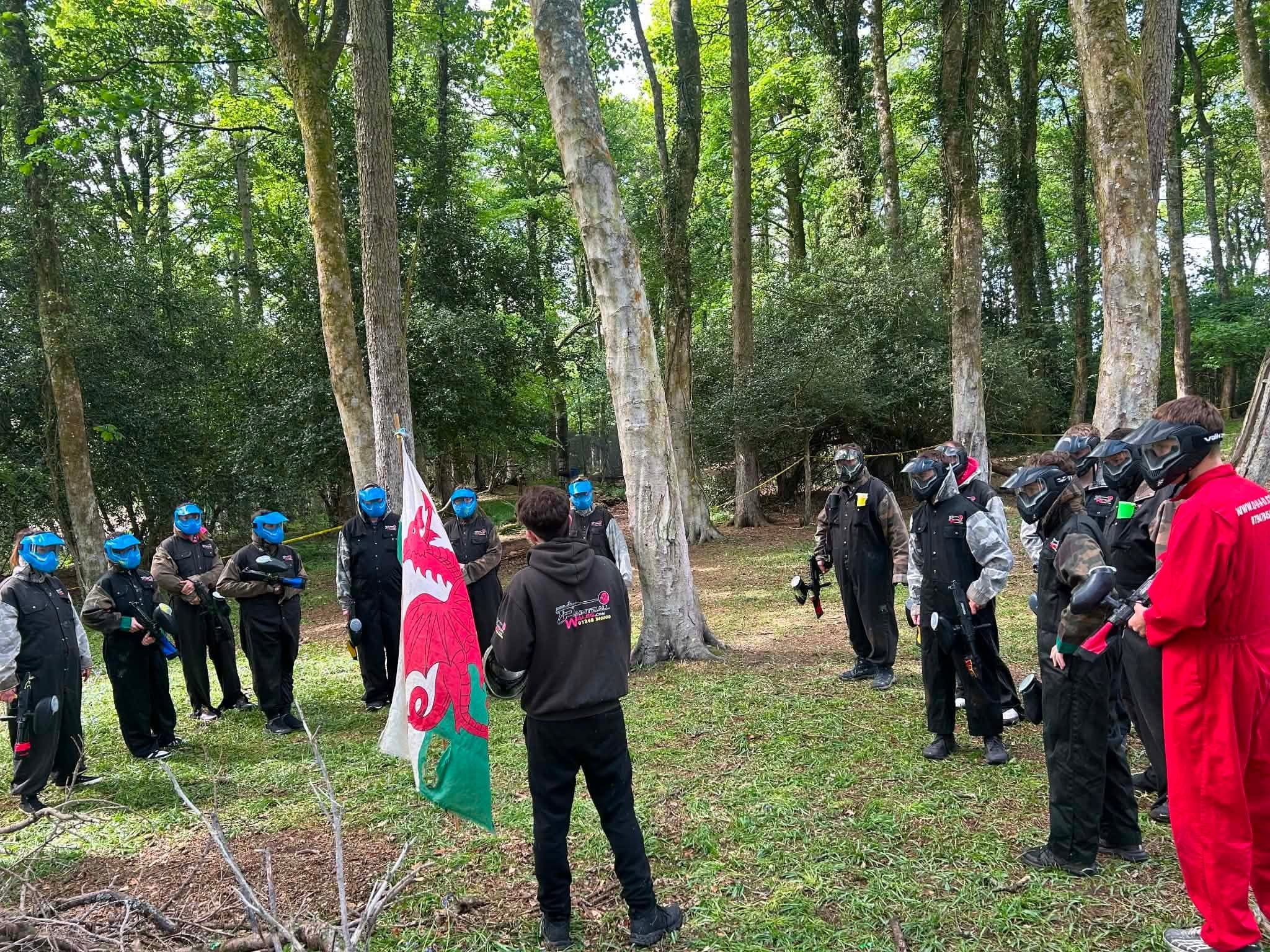 Staff explaining game rules with the flag