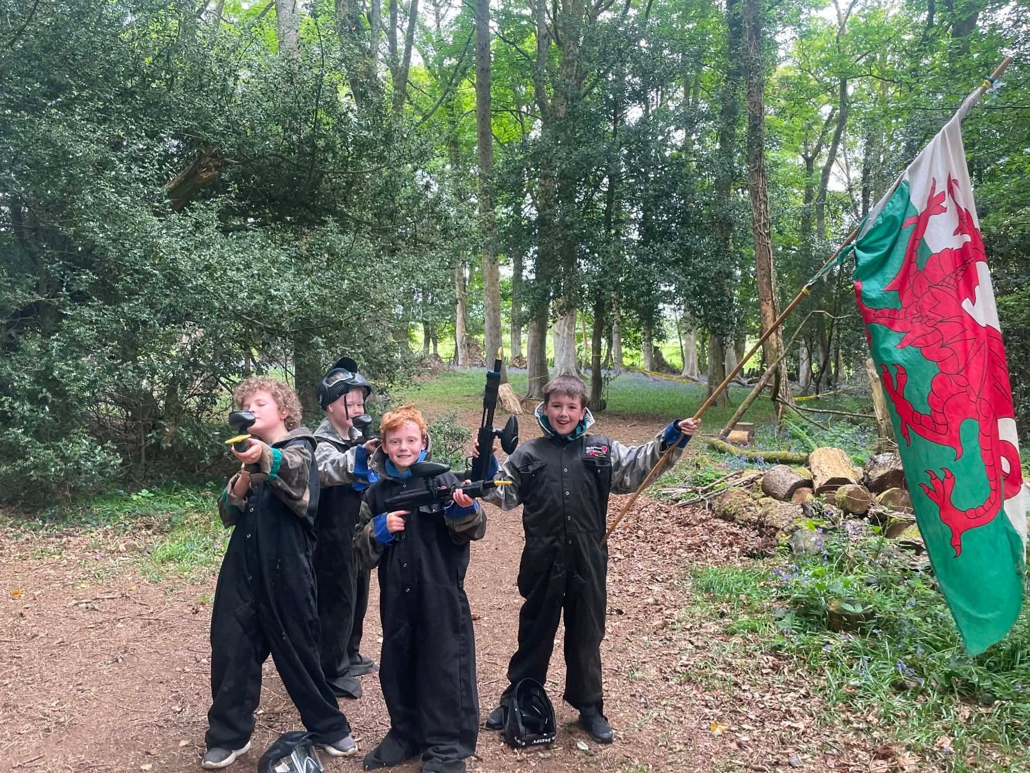 Kids birthday party playing capture the flag paintball