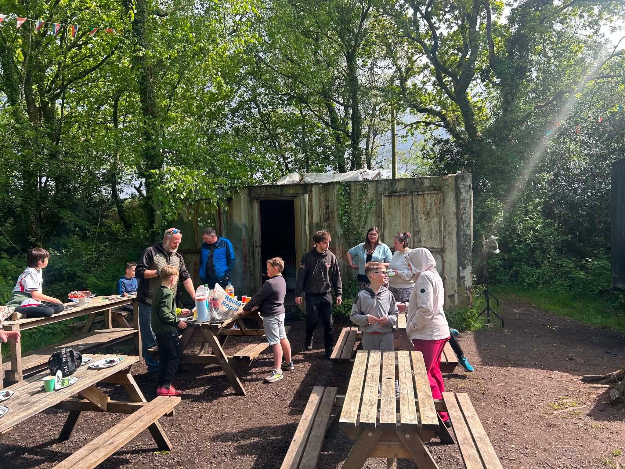 Kids enjoying lunch during a paintball birthday day out