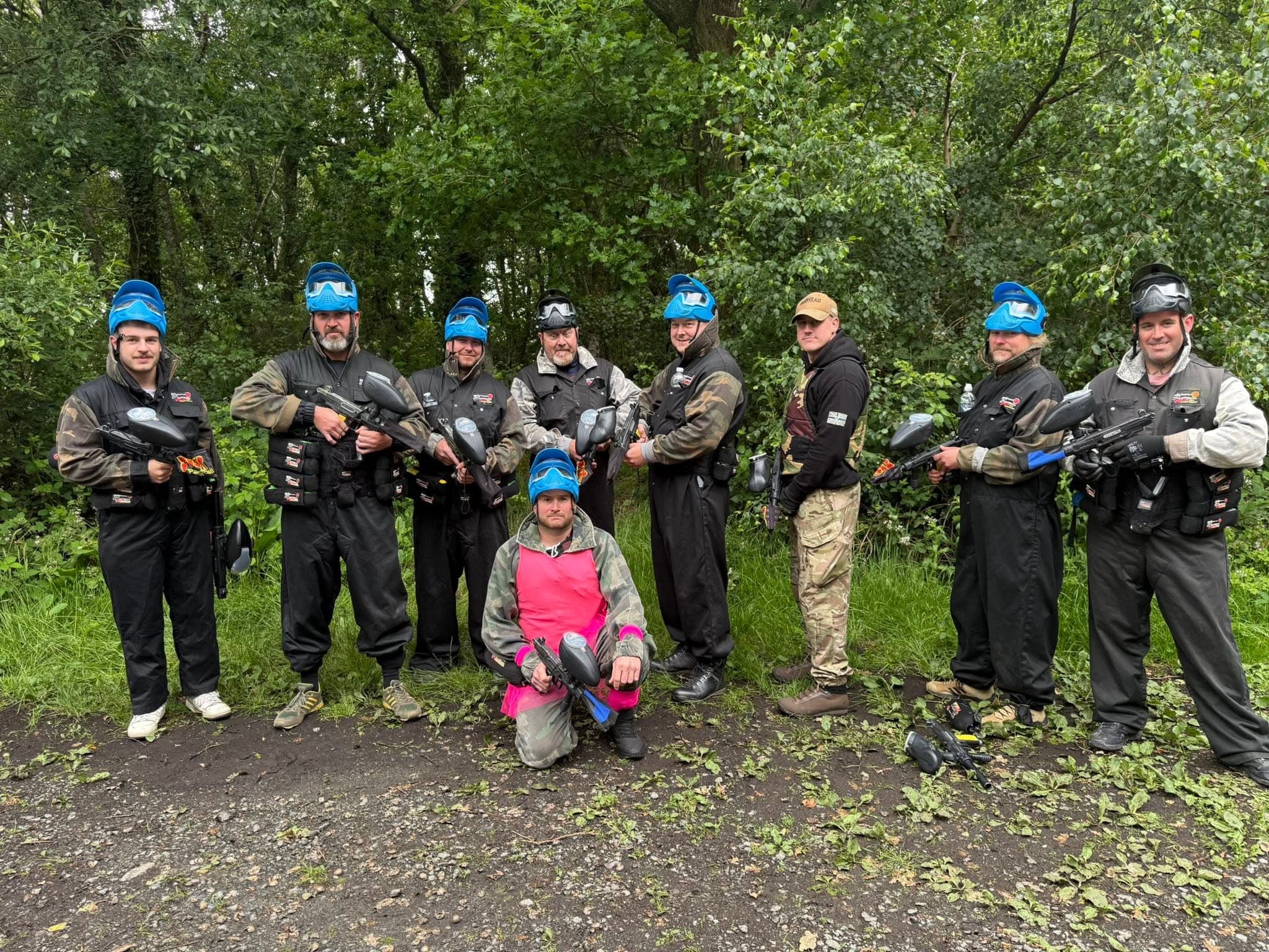 Stag party celebrating after paintball