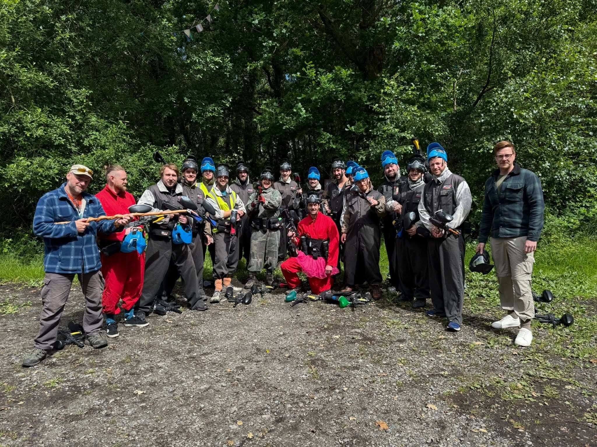 Stag do group in fancy dress with paintball markers at Paintball Wales