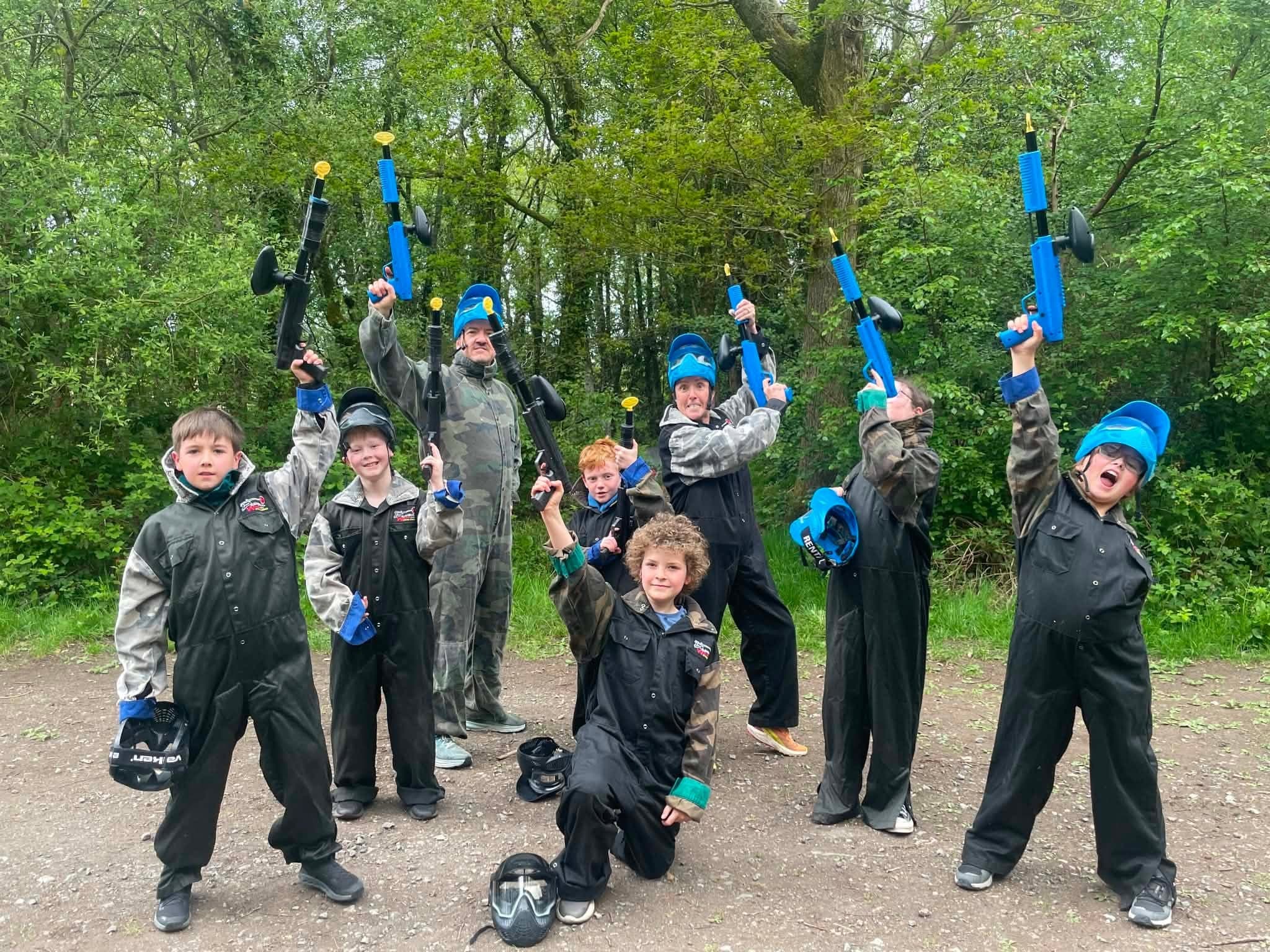 Kids celebrating a birthday paintball party